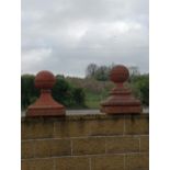 Two terracotta pier caps ball tops {H 65cm x 45 x 45}.