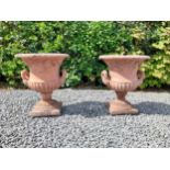 Pair of moulded terracotta lattice urns ivy leaf decoration {56 cm H x 46 cm Dia.}.