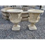 Pair of good quality moulded sandstone Grecian urns {57 cm H x 39 cm Dia.}.