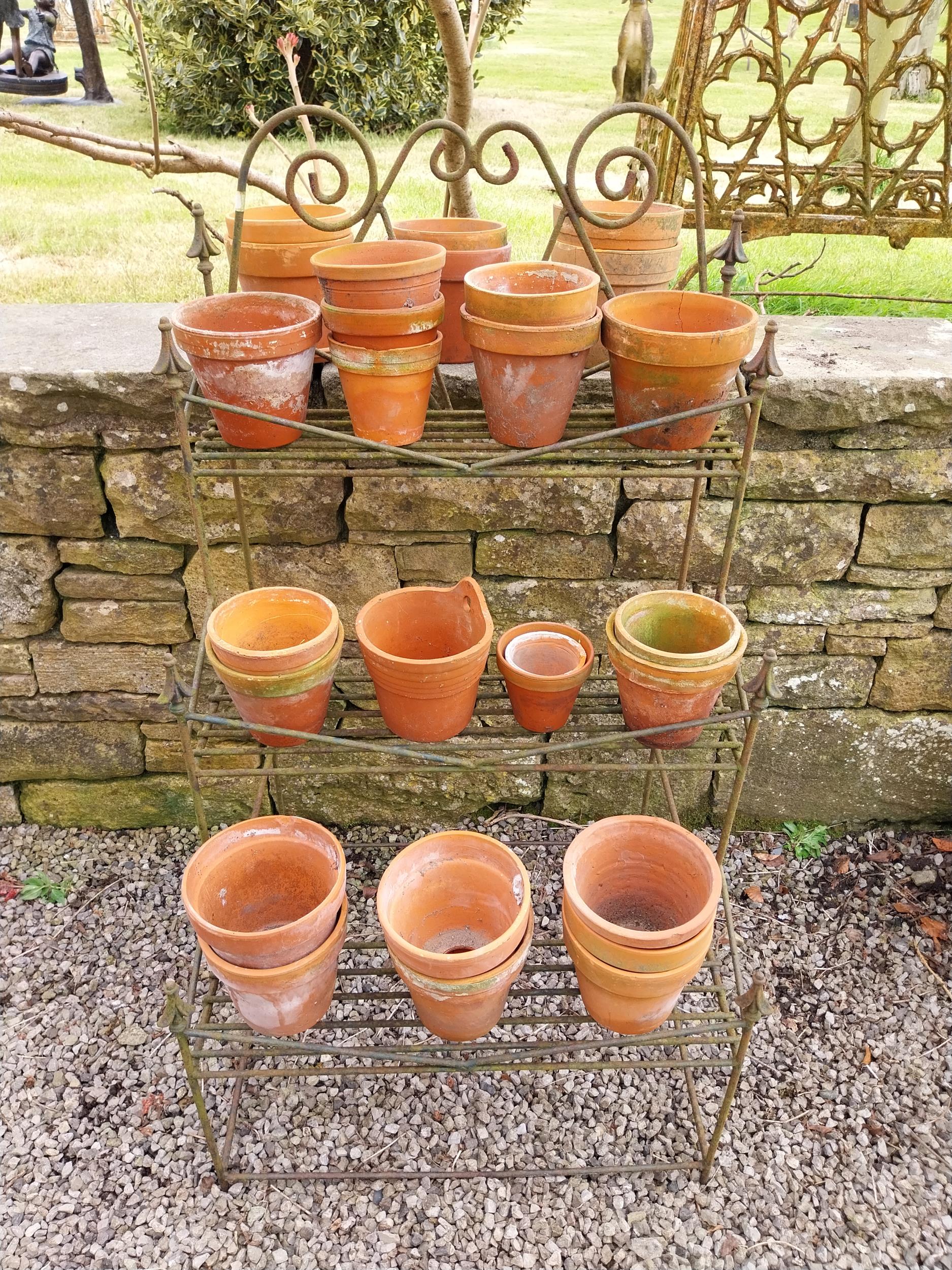 Large collection of terracotta plant pots.