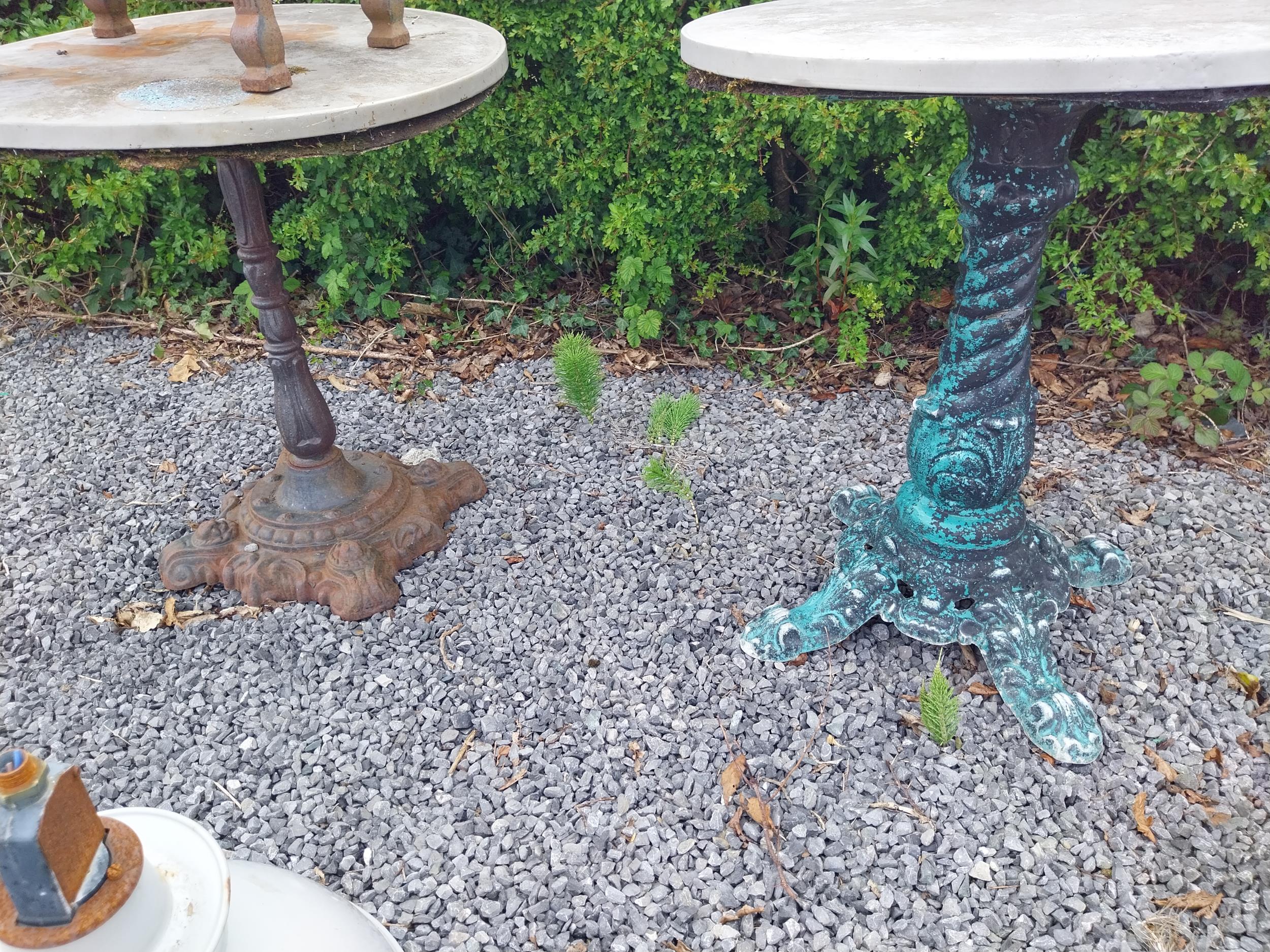 Two cast iron garden tables with zinc tops {74 cm H x 70 cm Dia. and 79 cm H x 70 cm Dia.}. - Image 2 of 2