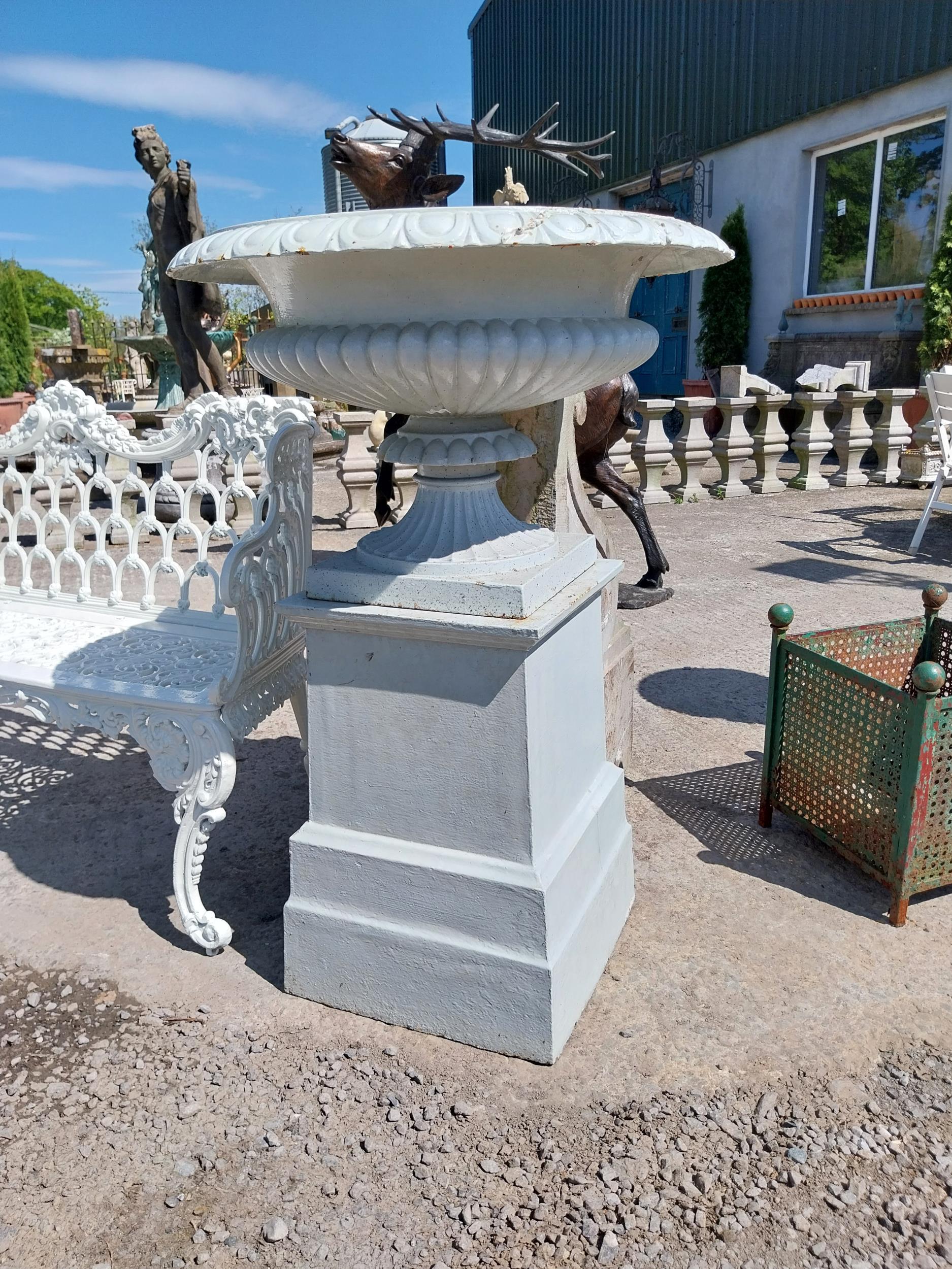 Pair of good quality early 19th C. cast iron urns raised on one buff terracotta pedestal decorated - Image 2 of 5