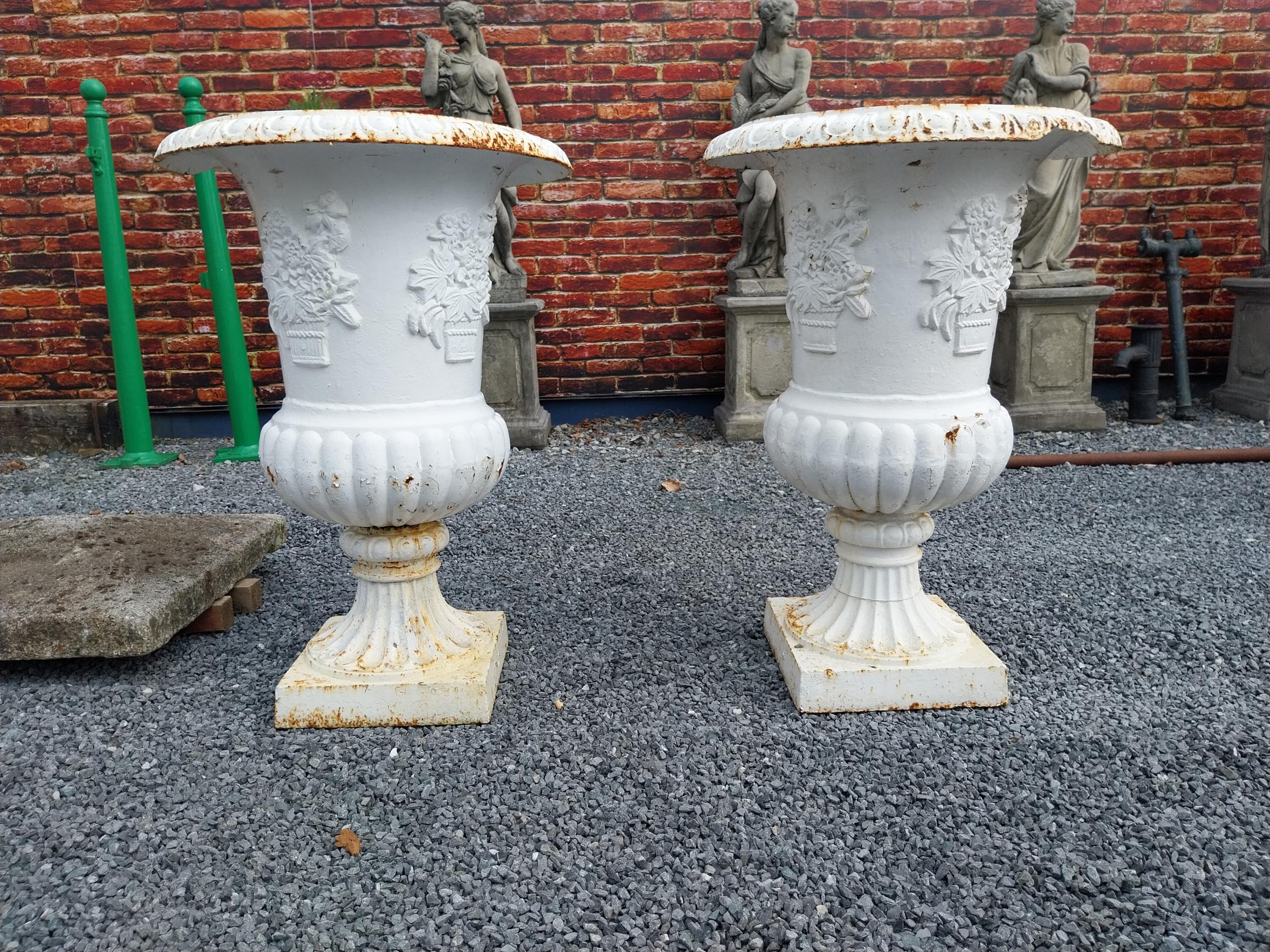 Pair of large good quality decorative cast iron garden urns {113 cm H x 76 cm Dia.}.