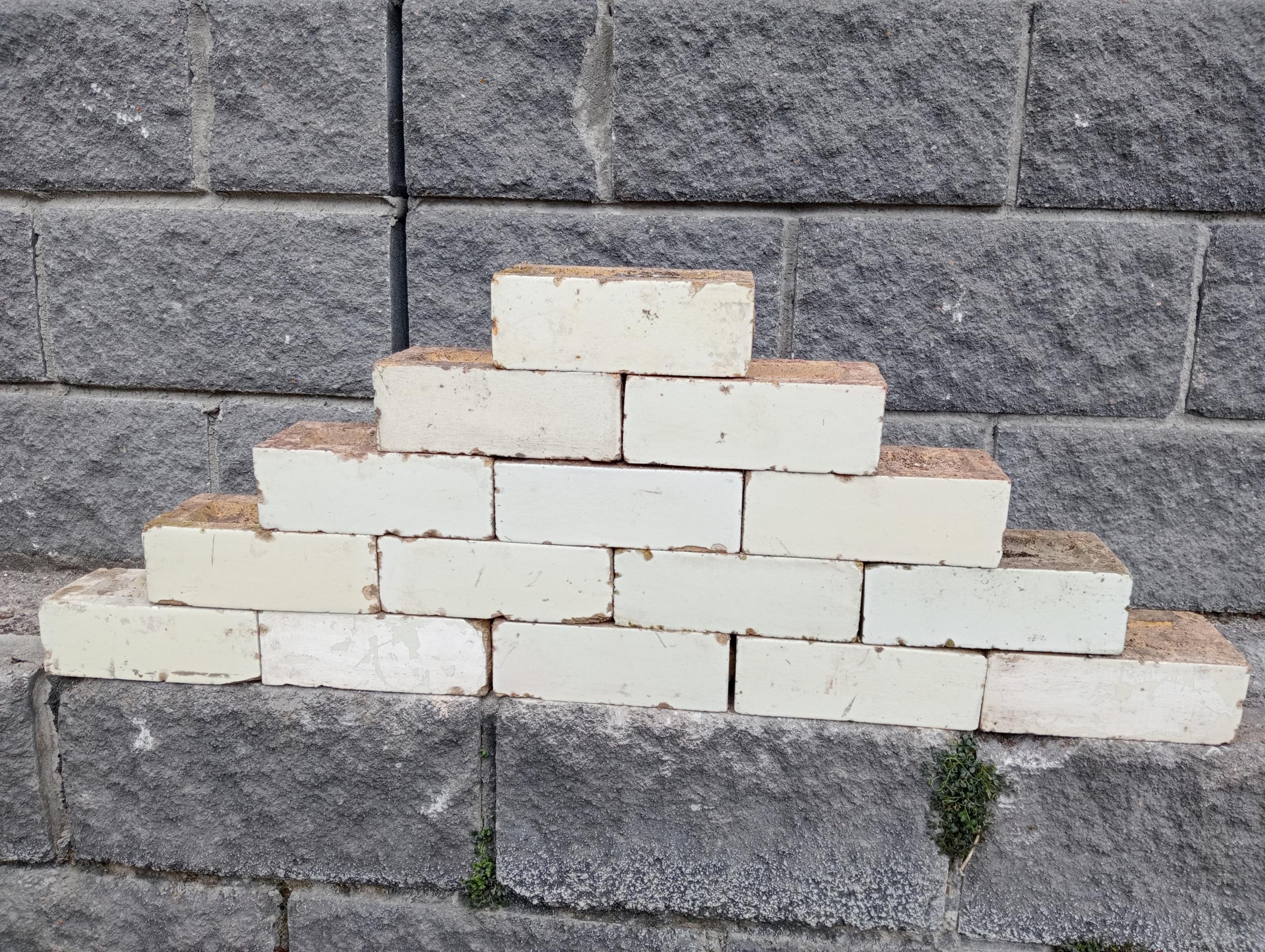 Collection of one hundred white glazed bricks {H 8cm x W 23cm x D 11cm }.