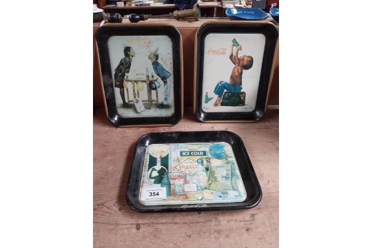 Three tin plate Coca Cola advertising drinks trays. {24 cm H x 27 cm W}. - Image 1 of 13