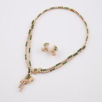 18k Yellow Gold Necklace And Earrings, set with 92 full cut emeralds, and 194 brilliant cut diamon