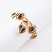 14k Yellow Gold Bracelet, bezel set with 7 oval agate cabochons, and completed with a gold padlock c