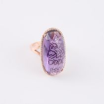 14k Rose Gold Cocktail Ring, set with an oval fancy cut amethyst (29.0 x 14.4mm) surrounded by 63 sm