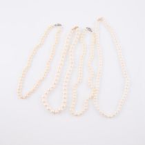 Four Single Strand Freshwater And Cultured Pearl Necklaces, (5.7mm to 8.7mm) set with 3 x 14k yellow