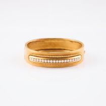 19th Century 14k Yellow Gold Hinged Bangle, set with a row of 20 halved pearls