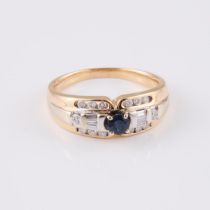 14k Yellow And White Gold Ring, set with a small full cut sapphire, 14 small brilliant cut, and 6 sm