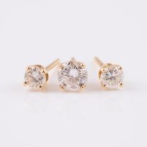 Pair Of 14k Yellow Gold Studs And A Single Stud, the pair set with 2 small brilliant cut diamonds (a