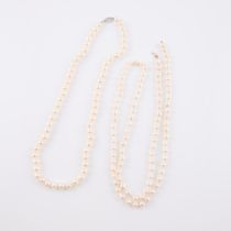 Two Single Strand Baroque Pearl Necklaces, (6.9mm to 8.4mm) the first strand completed with a 14k wh