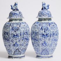 Pair of Delft Blue and White Fluted Octagonal Covered Vases, late 19th century, height 15.4 in — 39