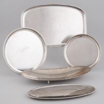 Group of Five English Arts & Crafts Style Stainless Steel Platters and Trays, Keswick School of Indu