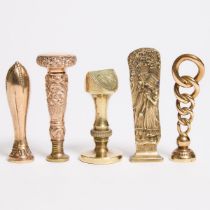 Five Victorian and Edwardian Gold Filled and Gilt Bronze Desk Seals, 19th/early 20th centuries, tall