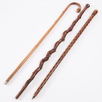 Two Folk Art Walking Sticks and a Japanese Cane, early 20th century, tallest height 36 in — 91.4 cm