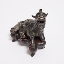 A Small Bronze Figure of a Recumbent Qilin, Late Ming Dynasty, 16th-17th Century, 晚明 铜麒麟纸镇, length 4