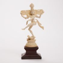 An Indian Ivory Figure of Shiva Nataraja, Early 20th Century, including stand height 11 in — 28 cm