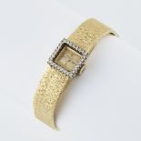 Lady's Bucherer Wristwatch, 17 jewel movement; in an 18k yellow gold case set with 28 small single c