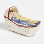 English Prattware Pottery Model of a Baby in a Cradle, early 19th century, length 3.1 in — 8 cm