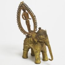 Indian Gilt Dhokra Model of an Elephant and Deity Rider Standing Within a Holy Prabha, early-mid 20t