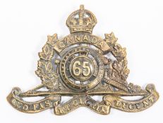 WWI Canadian CEF 65th Overseas Field Battery Canadian Field Artillery cap badge, with one of three