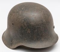 A Third Reich Luftwaffe M43 raw edge steel helmet, decal on left side, complete with lining and