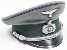 A Third Reich Army Chaplain's cap, with silver wire badge and cords, purple piping, and maker's name
