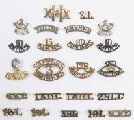 23 Indian metal shoulder titles, including pair of white metal bugle over "S.P.M.R", pair 6th