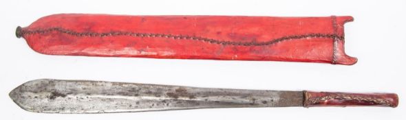 A Masai sword, seme, unusually wide blade 16½" x 2" at widest, with plain rawhide covered hilt, in