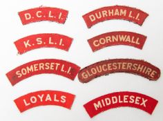 8 WWII British printed infantry shoulder titles, Middlesex, Loyals, Gloucestershire, Durham LI,