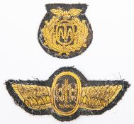 A gold bullion embroidered ATA (Air Transport Auxiliaries) cap badge, and a similar gold bullion