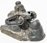 A spelter desk inkwell in the form of a French light tank ascending a rocky slope, with revolving