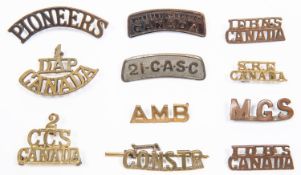 11 WWI Canadian metal shoulder titles: "2nd Depot Bn B.C. Regt", "21-C.A.S.C.", "1/DAP/CANADA", "2/