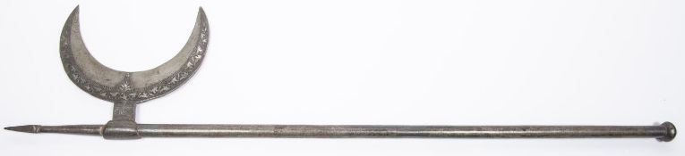 An Indian all steel axe, the crescent shaped head, socket and spike having silver koftgari