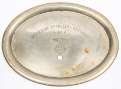 An oval nickel silver mess tray, engraved "DEUTSCHE ZEPPELIN REEDEREI G.M.B.H" above an eagle on a