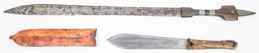 A North African sword, double edged blade 19½" with hatched decoration, the hilt of wood with grey