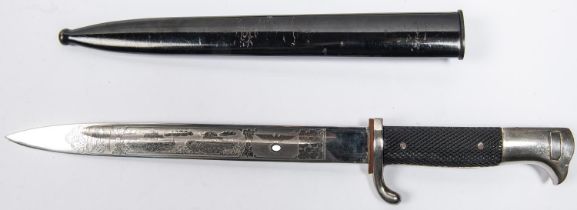 A Third Reich parade bayonet, the 9¾" blade with no maker's mark but etched on one side with eagles,