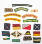 Selection of WWII British cloth insignia, titles etc, Royal Armoured Corps, Reconnaissance Regt,