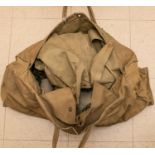 A WWII GS cape, 4 ET handles, 2 pairs of puttees, a khaki beret and a cop comforter. GC £70-100