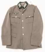 A Third Reich Infantry officer's tunic, with bullion breast eagle and collar patches and white