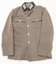 A Third Reich Infantry officer's tunic, with bullion breast eagle and collar patches and white