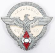 A Third Reich Hitler Youth Gausieger pin back badge, dated 1944, of painted grey metal, the back