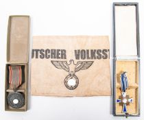 A Third Reich Luftschutz Decoration 2nd class, with ribbon, and pin, in its box with printed lid;