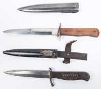 A WWI German Trench dagger "Nahkampfmesser", with 5½" blade, ribbed wood grips and steel crosspiece,