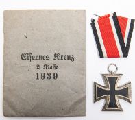 A 1939 Iron Cross 2nd class, in its original printed paper packet with a length of ribbon. GC (the