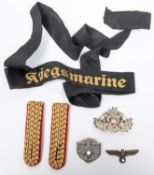 A pair of German Bahnschutz shoulder straps; a German Fireman's cap badge; a "tinnie" for "Deutsches
