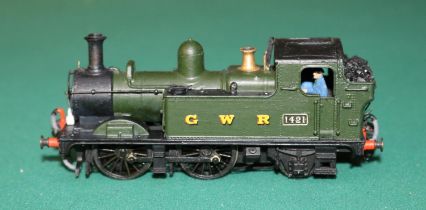 A fine quality brass OO gauge 2-rail electric GWR 0-4-2 Tank locomotive. RN 1421. In unlined
