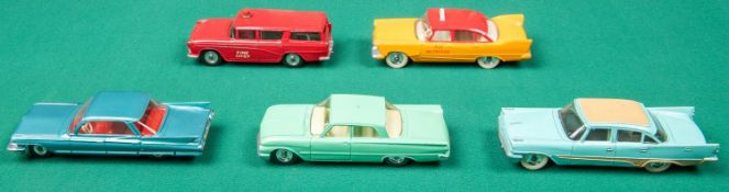 5 Dinky Toys. Cadillac 62 in metallic green. Ford Fairlane in light green, Plymouth Plaza Taxi in